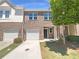 Charming brick townhouse with a one-car garage and inviting entrance at 1958 Millstream Holw, Conyers, GA 30012