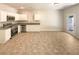 Open kitchen featuring stainless steel appliances and white cabinets at 1958 Millstream Holw, Conyers, GA 30012