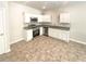 Bright kitchen with stainless steel appliances and white cabinets at 1958 Millstream Holw, Conyers, GA 30012