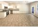Well-lit kitchen with stainless steel appliances, granite countertops, and ample cabinet space at 1958 Millstream Holw, Conyers, GA 30012