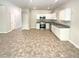 Open kitchen with stainless steel appliances and white cabinets at 1958 Millstream Holw, Conyers, GA 30012