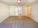 Spacious bedroom with neutral carpet and ensuite bathroom entrance at 1958 Millstream Holw, Conyers, GA 30012