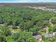 Panoramic aerial view showcases lush treeline, and the city in the distance at 6590 Williamson Ne Dr, Atlanta, GA 30328