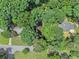 Overhead view of a home surrounded by lush, mature trees showing the neighborhood at 6590 Williamson Ne Dr, Atlanta, GA 30328