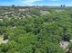Aerial view of a residential area featuring lush trees and city views at 6590 Williamson Ne Dr, Atlanta, GA 30328