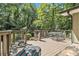 A tranquil back deck and patio with a wooded view provides an outdoor oasis at 6590 Williamson Ne Dr, Atlanta, GA 30328