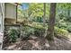 Private backyard with mature trees and wooden deck, creating a peaceful outdoor oasis for relaxation and entertainment at 6590 Williamson Ne Dr, Atlanta, GA 30328