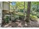 A shaded backyard features mature trees, mulch ground cover, and an outdoor deck at 6590 Williamson Ne Dr, Atlanta, GA 30328