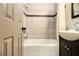 Bathroom featuring a tub, modern tiles and a decorative accent at 6590 Williamson Ne Dr, Atlanta, GA 30328
