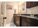 Elegant bathroom with double granite vanities, ample cabinet space, and a large mirror at 6590 Williamson Ne Dr, Atlanta, GA 30328