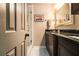 Stylish bathroom featuring granite vanities, a glass-enclosed shower, and neutral decor for a serene ambiance at 6590 Williamson Ne Dr, Atlanta, GA 30328