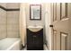 Stylish bathroom featuring tiled walls and a modern vanity, offering a spa-like experience at 6590 Williamson Ne Dr, Atlanta, GA 30328