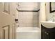 Contemporary bathroom showcasing tiled shower with a vanity, and a tiled showerhead at 6590 Williamson Ne Dr, Atlanta, GA 30328
