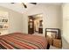 Comfortable bedroom featuring built-in shelves and natural light from the window at 6590 Williamson Ne Dr, Atlanta, GA 30328