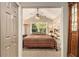 Cozy bedroom featuring natural light, built-in shelving, and a large window overlooking the landscape at 6590 Williamson Ne Dr, Atlanta, GA 30328