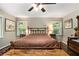 Comfortable bedroom featuring a classic style bed, side tables, and ample natural light at 6590 Williamson Ne Dr, Atlanta, GA 30328