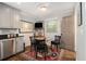 Cozy breakfast nook with a round table, seating for four, and natural light at 6590 Williamson Ne Dr, Atlanta, GA 30328
