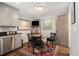 Cozy breakfast nook off the kitchen with a table, chairs, and natural light at 6590 Williamson Ne Dr, Atlanta, GA 30328