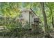 Well-maintained home with a private balcony, surrounded by lush greenery and mature trees, offering a secluded retreat at 6590 Williamson Ne Dr, Atlanta, GA 30328