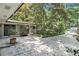 View of the entrance and an outdoor patio, showcasing the architectural style and landscaping of the home at 6590 Williamson Ne Dr, Atlanta, GA 30328