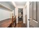 Hallway with hardwood floors, storage and natural light, connecting rooms and creating a welcoming flow at 6590 Williamson Ne Dr, Atlanta, GA 30328