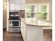 Updated kitchen with stainless steel appliances, granite countertops, and ample cabinet space at 6590 Williamson Ne Dr, Atlanta, GA 30328