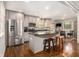 Eat-in kitchen featuring stainless steel appliances, granite counters, and a peninsula with bar stool seating at 6590 Williamson Ne Dr, Atlanta, GA 30328