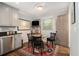 Cozy kitchen nook features a small table, perfect for morning coffee and casual dining by the door at 6590 Williamson Ne Dr, Atlanta, GA 30328