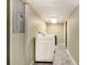Functional laundry room with a washer and dryer set against light green walls at 6590 Williamson Ne Dr, Atlanta, GA 30328