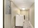Laundry room features a washer and dryer with tile flooring and clean, painted walls at 6590 Williamson Ne Dr, Atlanta, GA 30328