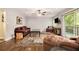 Bright living room featuring hardwood floors, comfortable seating, a sliding glass door to the deck at 6590 Williamson Ne Dr, Atlanta, GA 30328