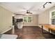 Living room with hardwood floors and partial view of the eat-in kitchen at 6590 Williamson Ne Dr, Atlanta, GA 30328