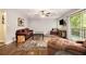 Living room featuring hardwood floors, a ceiling fan, ample space, and natural light at 6590 Williamson Ne Dr, Atlanta, GA 30328