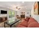 Cozy living room boasts hardwood floors, natural light, a ceiling fan, and an adjacent dining area at 6590 Williamson Ne Dr, Atlanta, GA 30328