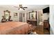 Comfortable main bedroom boasts vintage furniture, wood floors and great natural light at 6590 Williamson Ne Dr, Atlanta, GA 30328