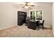 Home office with neutral carpet, a large desk, and a window providing natural light at 6590 Williamson Ne Dr, Atlanta, GA 30328