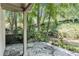 Enjoy a relaxing patio view surrounded by lush greenery and a tranquil stream at 6590 Williamson Ne Dr, Atlanta, GA 30328