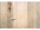 Elegant shower stall featuring marble-like tiling and modern fixtures for a spa-like experience at 6590 Williamson Ne Dr, Atlanta, GA 30328