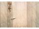 Modern shower boasting marble tiling and a rainfall shower head at 6590 Williamson Ne Dr, Atlanta, GA 30328