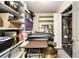 Basement storage area with shelving, a water heater, and extra room for organizing belongings at 6590 Williamson Ne Dr, Atlanta, GA 30328
