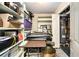 Well used storage area with metal shelving, a hot water tank, and assorted items at 6590 Williamson Ne Dr, Atlanta, GA 30328