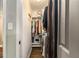 Walk-in closet offers ample storage with shelving, hanging rods and room for organization at 6590 Williamson Ne Dr, Atlanta, GA 30328