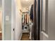 Walk-in closet with shelving and clothes racks for optimal storage solutions at 6590 Williamson Ne Dr, Atlanta, GA 30328