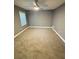 Well-lit bedroom offering carpeted floors, a ceiling fan and large window at 6832 Shangrila Way, Riverdale, GA 30296