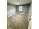 Bedroom featuring neutral walls, carpeted floor and natural light at 6832 Shangrila Way, Riverdale, GA 30296
