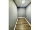 Bright hallway with wood-look flooring and freshly painted walls at 6832 Shangrila Way, Riverdale, GA 30296