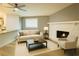 Well-lit living room with a cozy fireplace and neutral decor at 6832 Shangrila Way, Riverdale, GA 30296