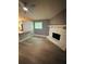 Cozy living room with a stone fireplace and modern flooring at 6832 Shangrila Way, Riverdale, GA 30296