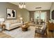 Tastefully staged living and dining room area with contemporary furniture and decor at 6832 Shangrila Way, Riverdale, GA 30296
