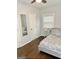 Cozy bedroom with natural light, hardwood floors and a comfortable queen-sized bed at 1081 Ashby Grv, Atlanta, GA 30314